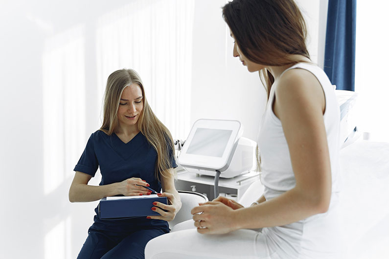 Photo Of Woman Talking To a Sick Patient