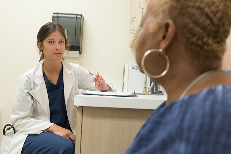 A doctor and patient discuss a return to work plan