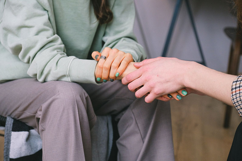 A doctor supporting a patient during counseling