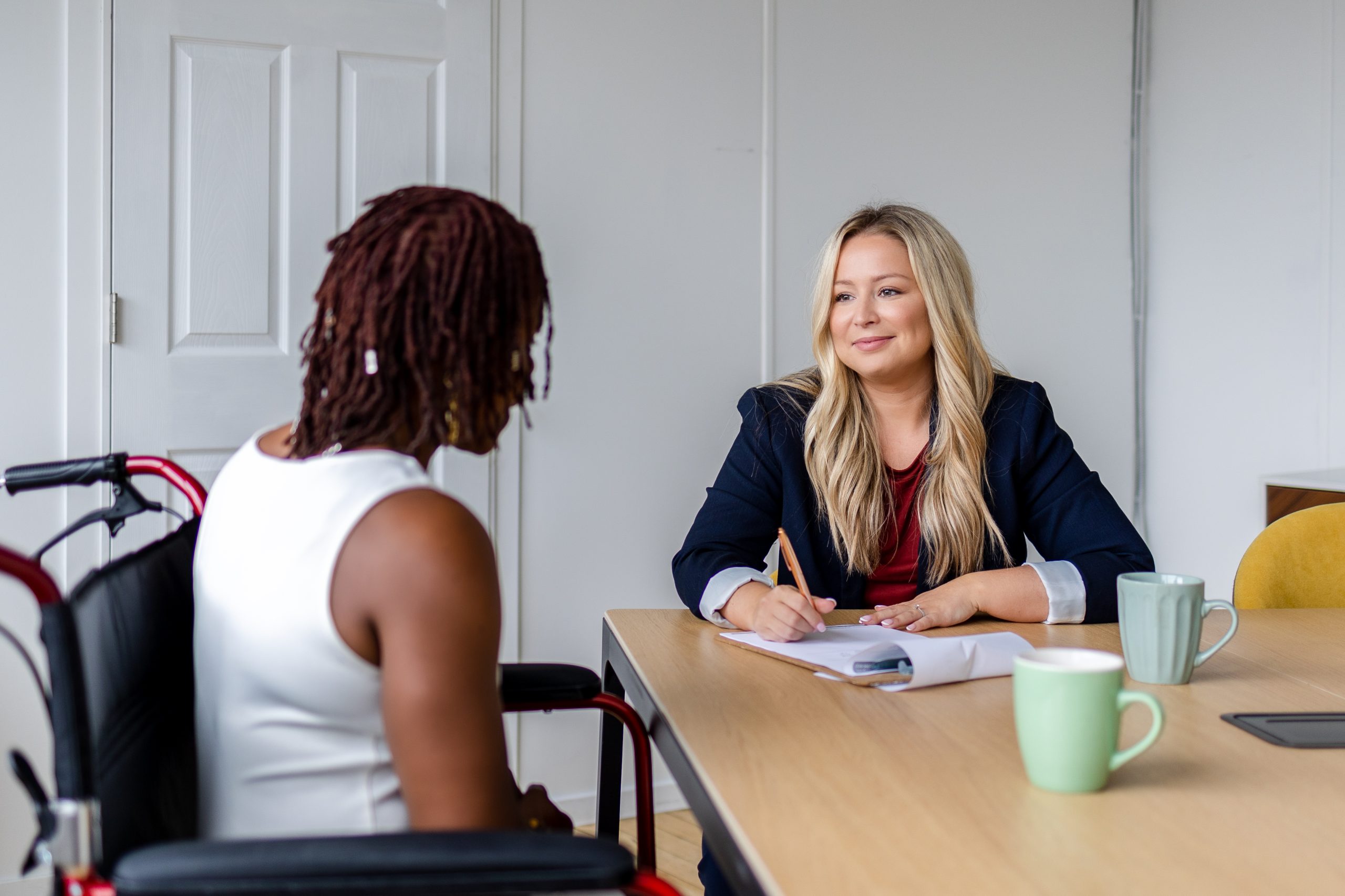 Ertl Lawyers consulting with disabled woman