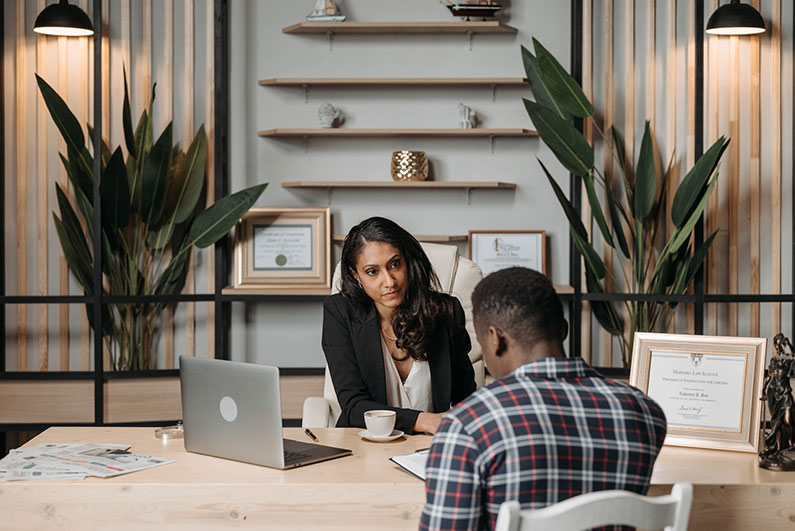 A lawyer and client discuss his performance improvement plan.