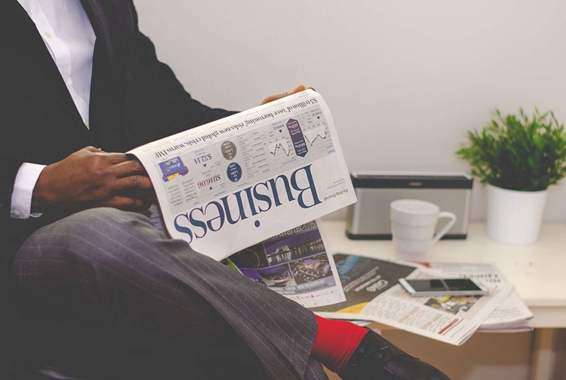  A man looking for work in a newspaper